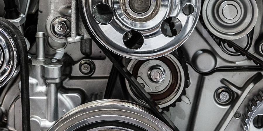 Close up of BMW water pump pulley and serpentine belt