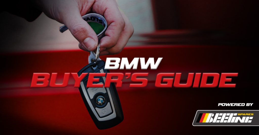 A person's hand holding a set of BMW keys and text reading "BMW buyer's guide"